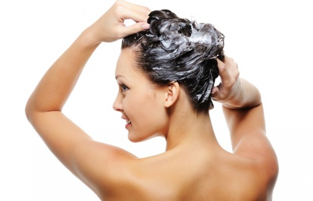 a girl shampooing her hair