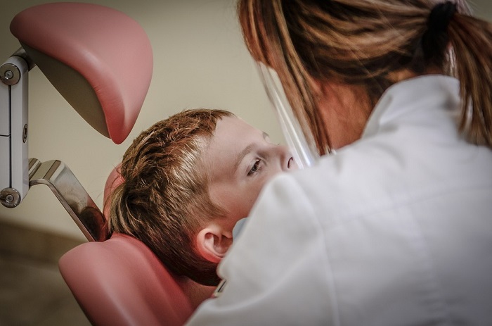 a child in a dental office chair