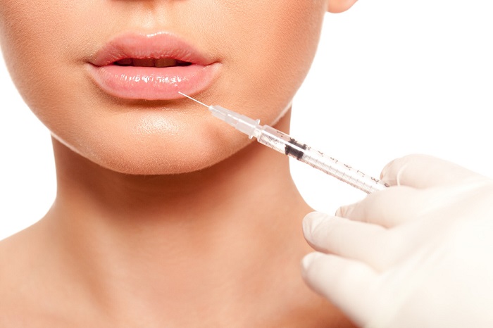 an image of a woman having a facial injection