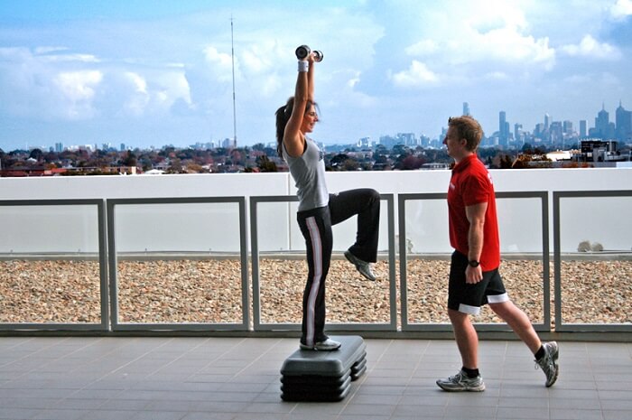 a girl training with her personal trainer