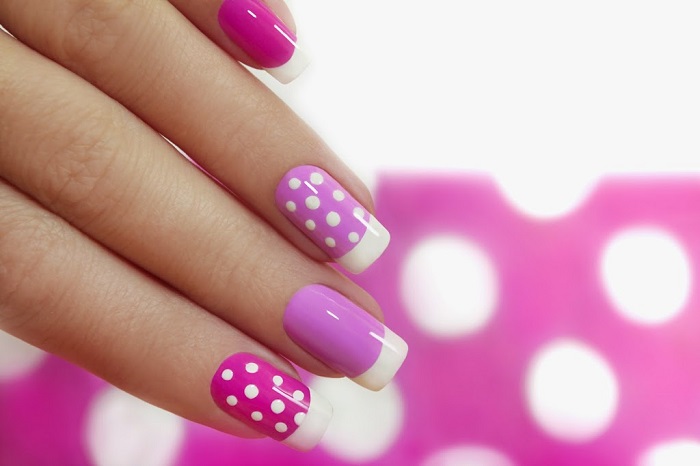 a woman's hand with gorgeous dotted manicure