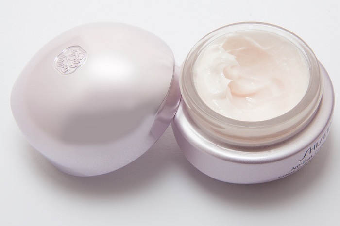 an opened jar of face cream