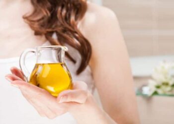 2 holding olive oil