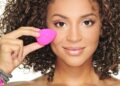1 woman using a beauty blender