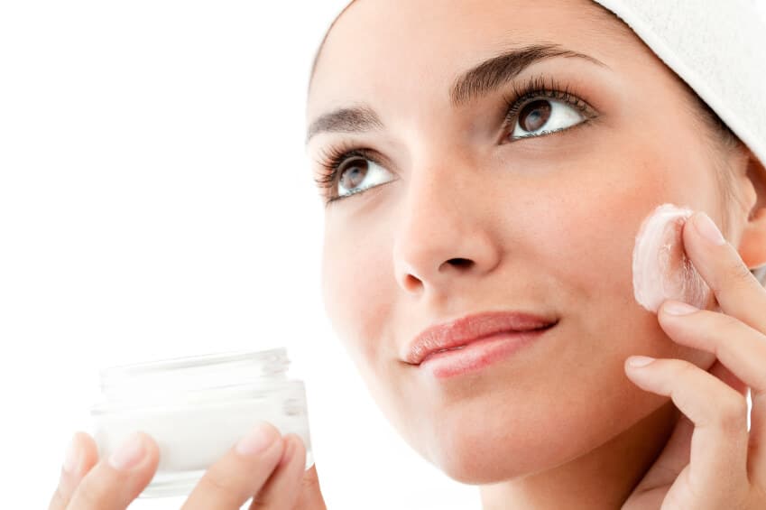 1 woman applying face cream