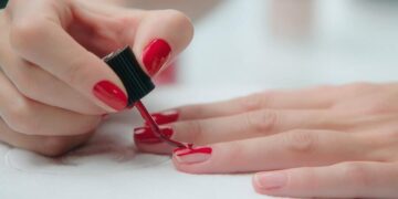 1 woman painting her nails 1