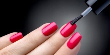 1 woman painting her nails