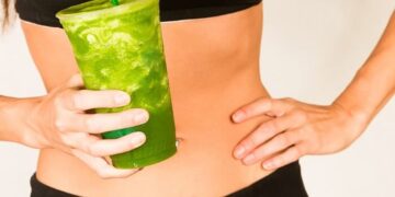 1 slender woman with green smoothie
