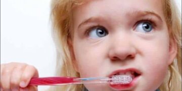 child brushing teeth