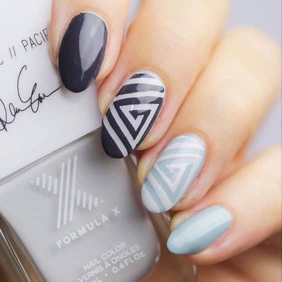geometric nail art swirling angles contrasting colors