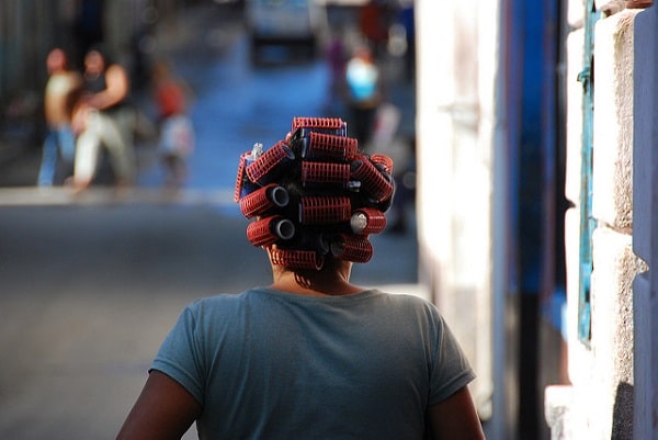 woman with hair rollers on